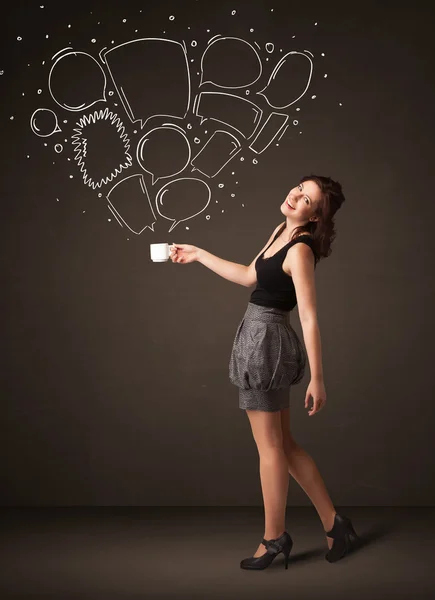 Businesswoman holding a white cup with speech bubbles — Stock Photo, Image