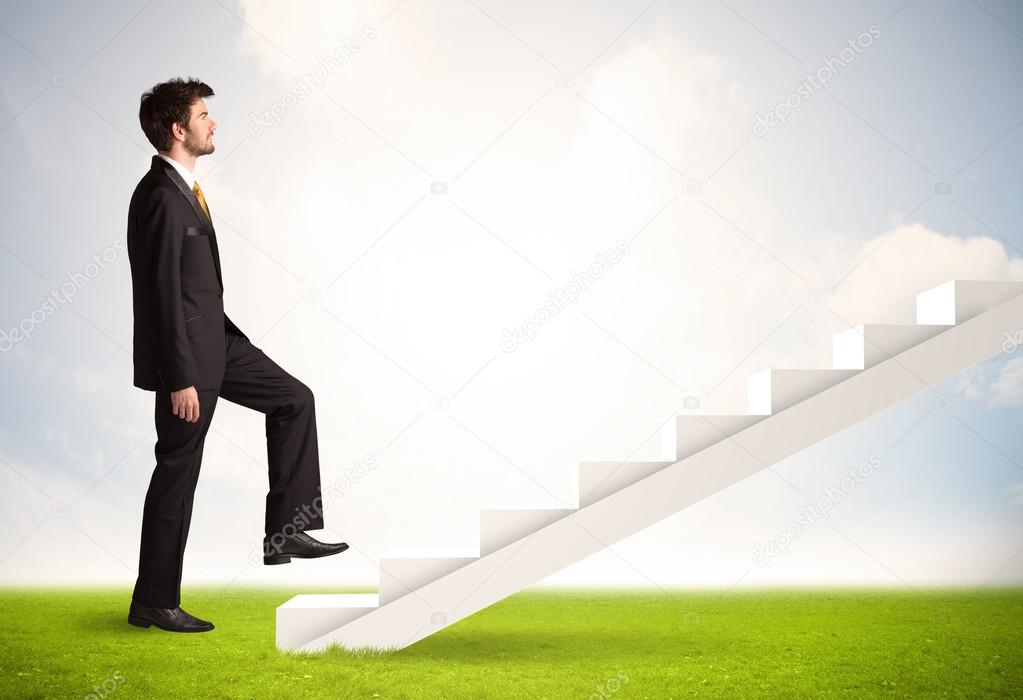 Business person climbing up on white staircase in nature