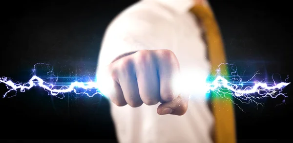 Business man holding electricity light bolt in his hands — Stock Photo, Image