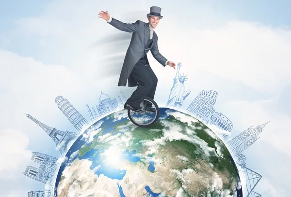 Man riding unicycle around the globe with major cities — Stock Photo, Image