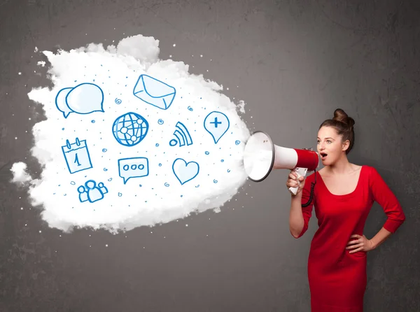 Woman shouting into loudspeaker and modern blue icons and symbol — Stock Photo, Image