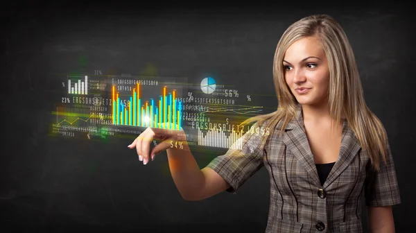 Young business woman touching colorful charts and diagrams — Stock Photo, Image