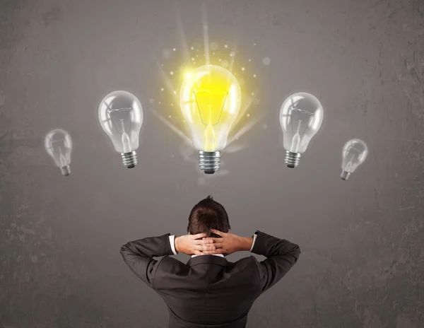 Business person having an idea light bulb concept — Stock Photo, Image