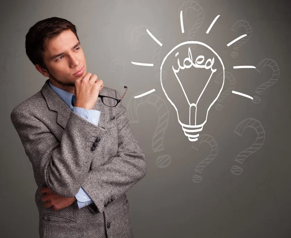 Young boy comming up with a light bulb idea sign — Stock Photo, Image