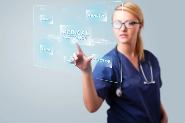 Young nurse pressing modern medical type of buttons — Stock Photo, Image