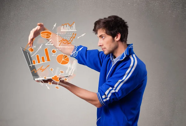 Handsome man holding laptop with graphs and statistics — Stock Photo, Image