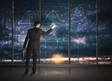 İş adamı iş grafikleri çiziyor