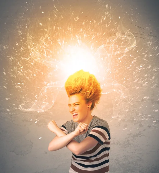 Young woman with energetic exploding red hair — Stock Photo, Image