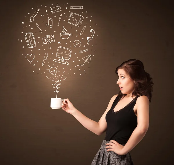 Businesswoman holding a white cup with social media icons — Stock Photo, Image