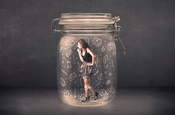 Business woman captured in glass jar with hand drawn media icons — Stock Photo, Image