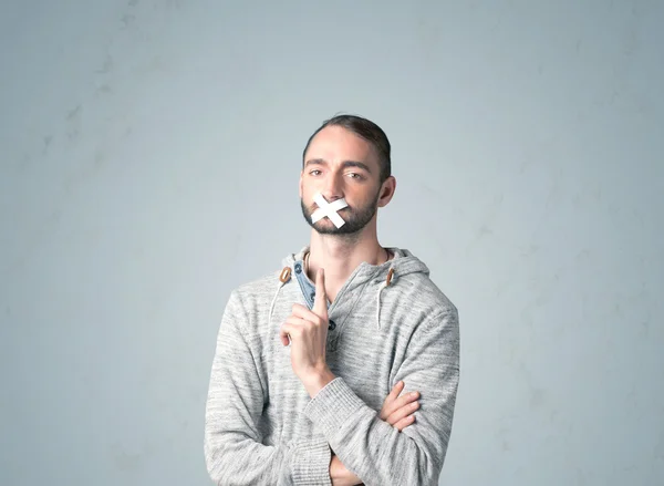 Young man with glued mouth — Stock Photo, Image