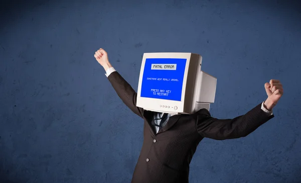 Person with a monitor head and fatal error blue screen on the di — Stock Photo, Image