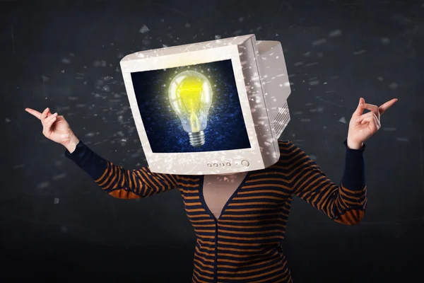 Young girl with a monitor head, idea light bulb on the display s — Stock Photo, Image