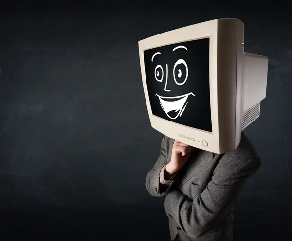 Hombre de negocios feliz con una cabeza de monitor de PC y una cara sonriente — Foto de Stock