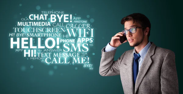 Young man making phone call with word cloud