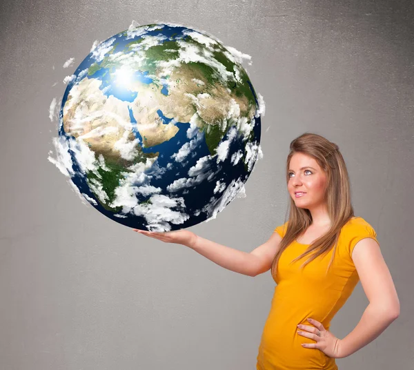 Pretty girl holding 3d planet earth — Stock Photo, Image