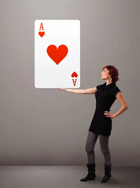 Beautifu woman holding a red heart ace — Stock Photo, Image