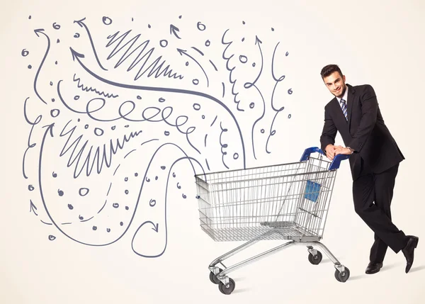 Businessman with shopping cart — Stock Photo, Image
