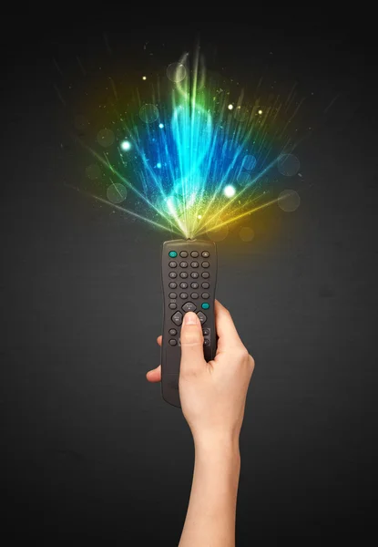 Hand with remote control and explosive signal — Stock Photo, Image