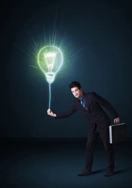 Businessman with an idea bulb — Stock Photo, Image