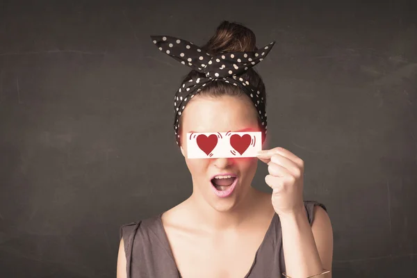 Pretty girl holding paper with red heart drawing — Stock Photo, Image