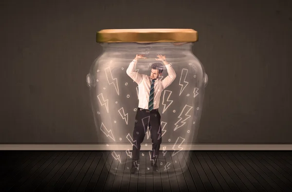 Businessman inside a glass jar with lightning drawings concept — Stock Photo, Image