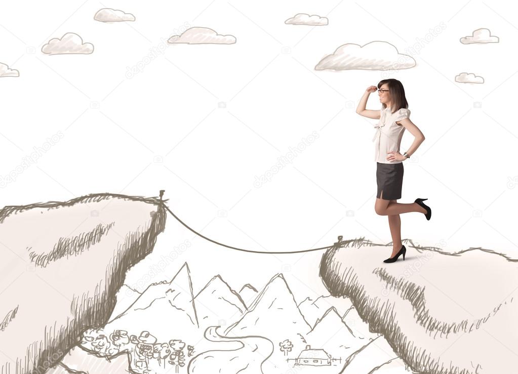 Businesswoman with drawn edge of mountain