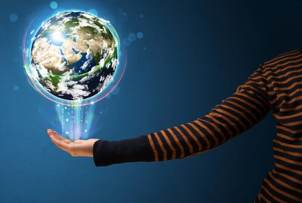 Woman holding a glowing earth globe — Stock Photo, Image