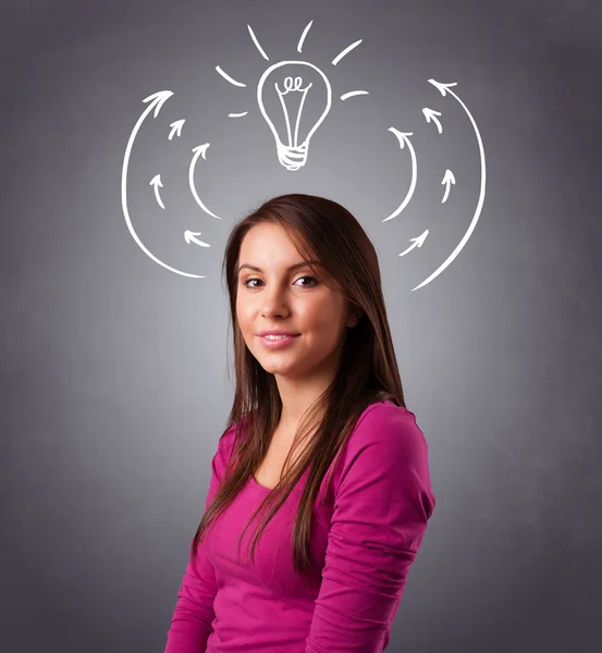 Pretty lady thinking with arrows and light bulb overhead — Stock Photo, Image