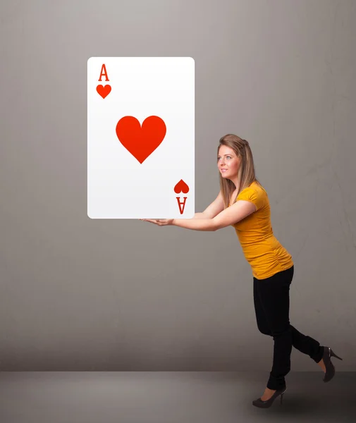 Beautifu woman holding a red heart ace — Stock Photo, Image