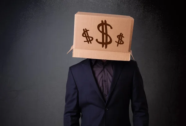 Fiatal férfi intett egy karton doboz, a fejét a dollár — Stock Fotó