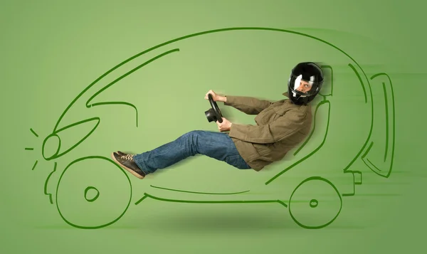 Homme conduit une voiture électrique dessinée à la main écologique — Photo