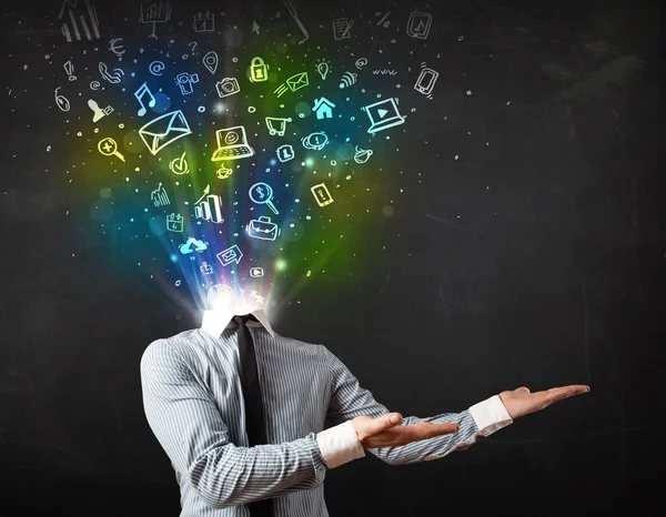 Business man with glowing media icons exploding head — Stock Photo, Image