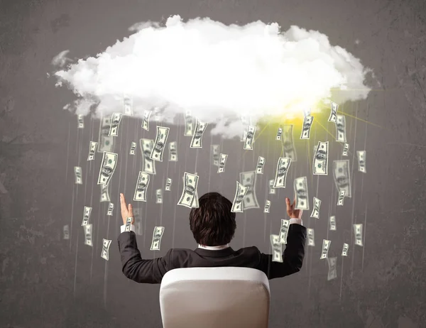 Business man in suit looking at cloud with falling money — Stock Photo, Image