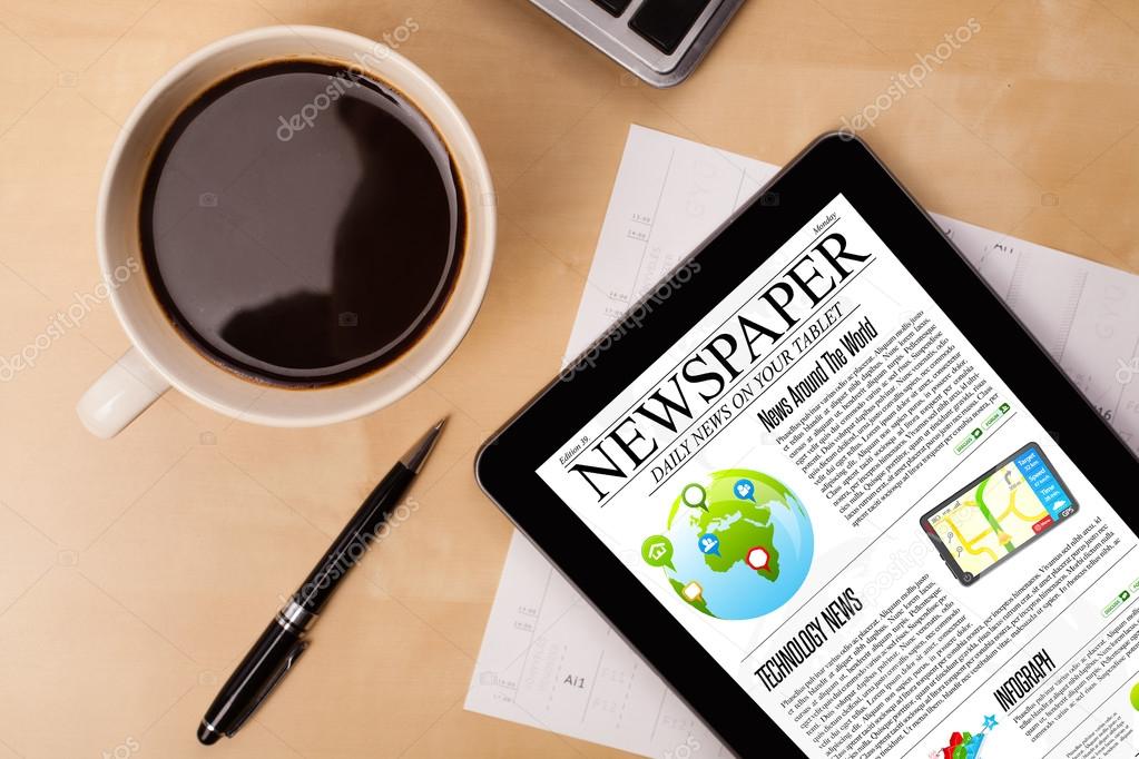 Tablet pc shows news on screen with a cup of coffee on a desk