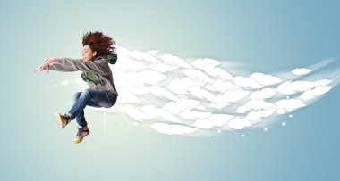 Healthy young woman jumping with feathers around her clipart