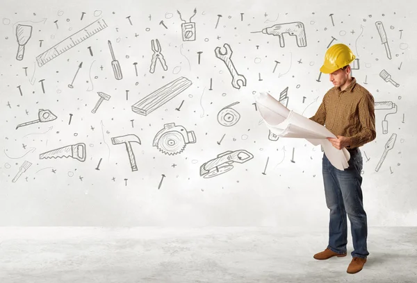 Construction worker planing with hand drawn tool icons — Stock Photo, Image