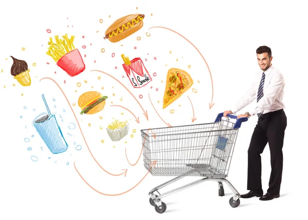 Man with shopping cart with toxic junk food — Stock Photo, Image