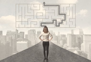 Business woman looking at road with maze and solution clipart