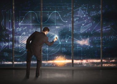 İş adamı iş grafikleri çiziyor