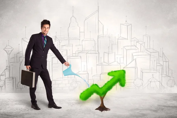 Business man watering green plant arrow — Stock Photo, Image