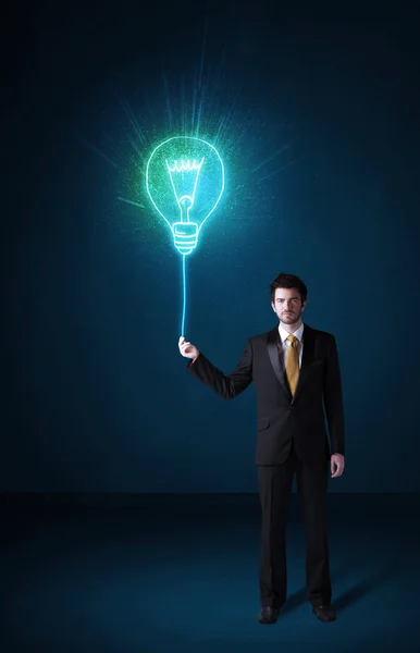 Businessman with an idea bulb — Stock Photo, Image