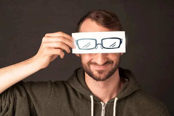 Happy guy looking with paper hand drawn eye glasses — Stock Photo, Image