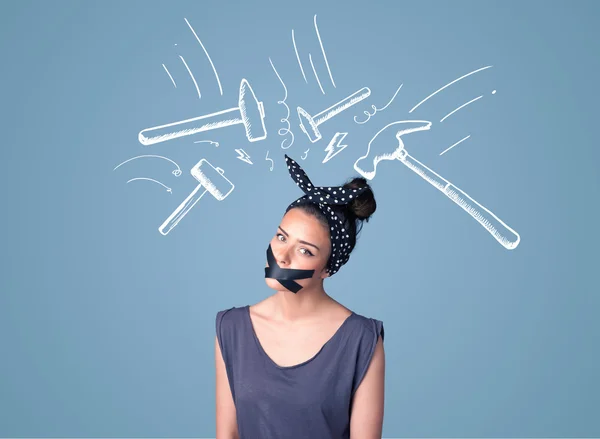 Young woman with glued mouth and hammer marks — Stock Photo, Image