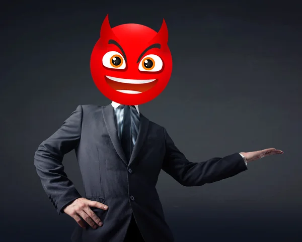 Hombre de negocios lleva cara sonriente diablo —  Fotos de Stock