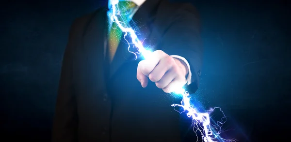 Business man holding electricity light bolt in his hands — Stock Photo, Image