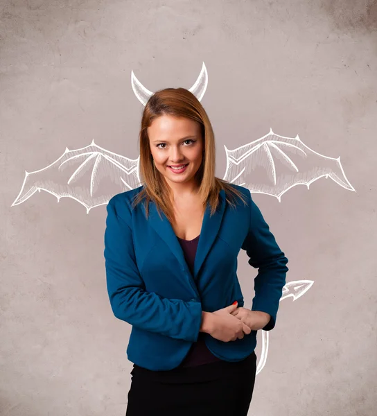 Young girl with devil horns and wings drawing — Stock Photo, Image