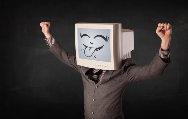 Hombre de negocios feliz con un monitor de computadora y una cara sonriente —  Fotos de Stock