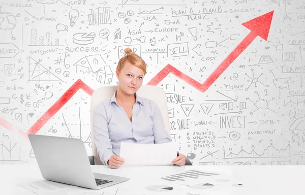 Zakelijke vrouw zit aan tafel met marktdiagrammen — Stockfoto