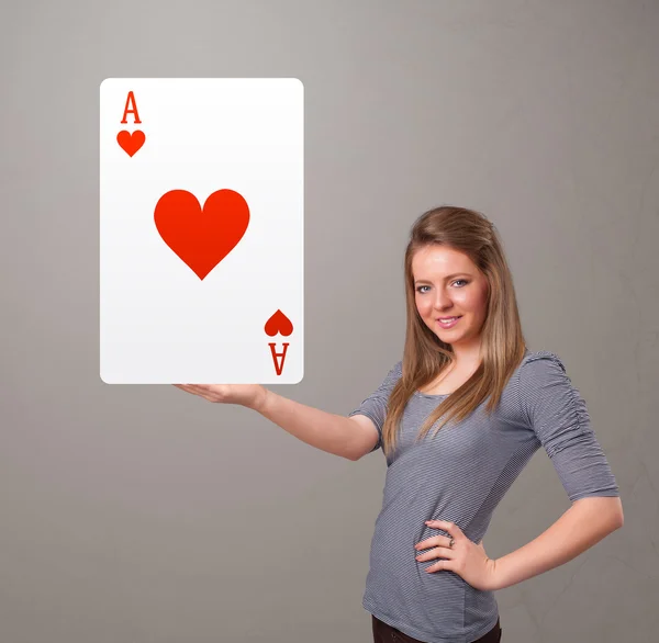 Beautifu woman holding a red heart ace — Stock Photo, Image